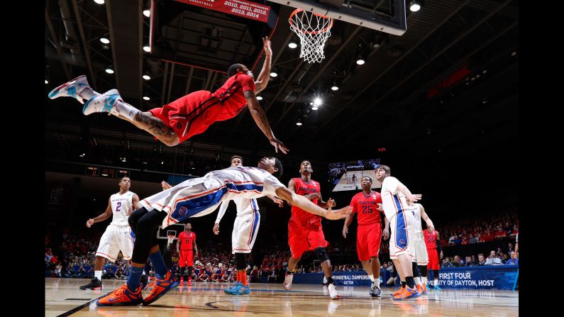 Dayton's Kyle Davis leaps over Boise State's Chandler Hutchison during an NCAA Tournament game played Wednesday, March 18, in Dayton, Ohio. Dayton won 56-55 in what was a "First Four" matchup, and the team would go on to beat Providence in the next round before losing to Oklahoma in the round of 32.
