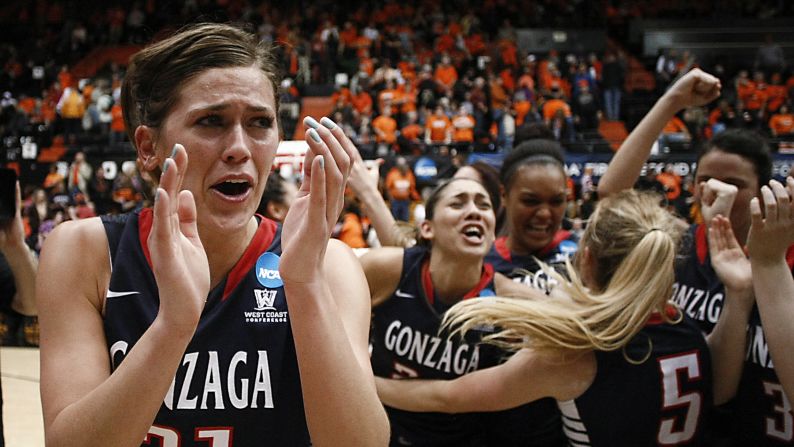 Elle Tinkle, left, and her Gonzaga teammates celebrate their second-round victory over Oregon State in the NCAA Tournament on Sunday, March 22. Tinkle's father, Wayne, is the coach of Oregon State.