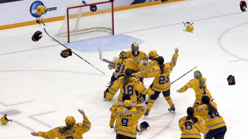 Hockey players from the University of Minnesota rejoice after defeating Harvard 4-1 to win the NCAA championship Sunday, March 22, in Minneapolis. It is Minnesota's third national title in the past four years.