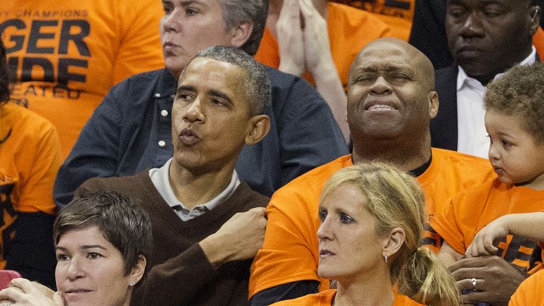 U.S. President Barack Obama and his brother-in-law, Craig Robinson, react while watching Robinson's daughter play in the NCAA Tournament on Saturday, March 21. Leslie Robinson and her Princeton team defeated Wisconsin-Green Bay 80-70 in College Park, Maryland.