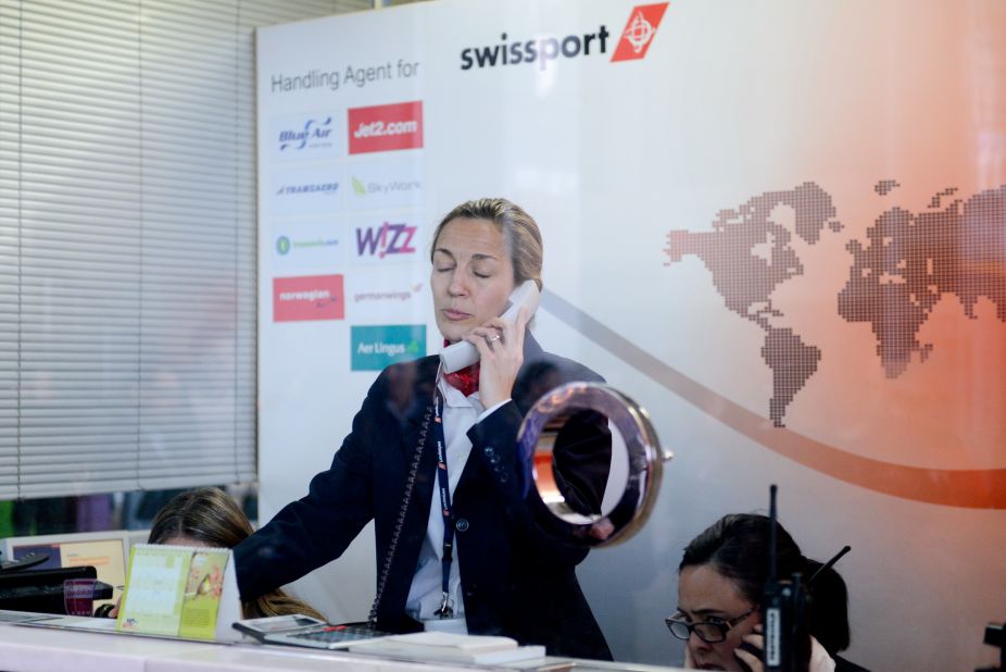 An employee of Swissport, the handling agent of Germanwings flights from Barcelona, speaks by phone at the Barcelona-El Prat Airport on March 24.
