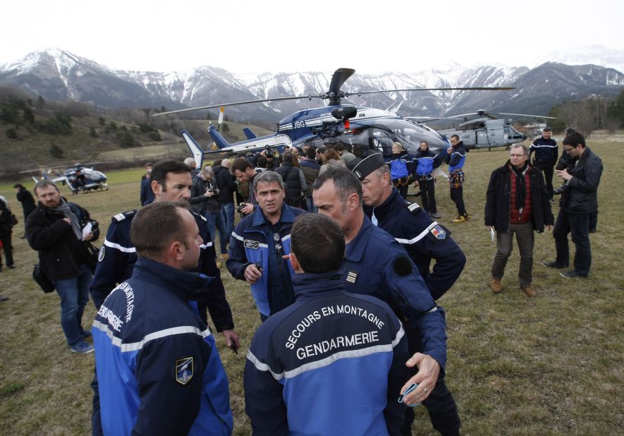 Rescue workers and members of the French Gendarmerie gather in Seyne-les-Alpes on Tuesday, March 24, as search-and-rescue teams struggle to reach the remote crash.