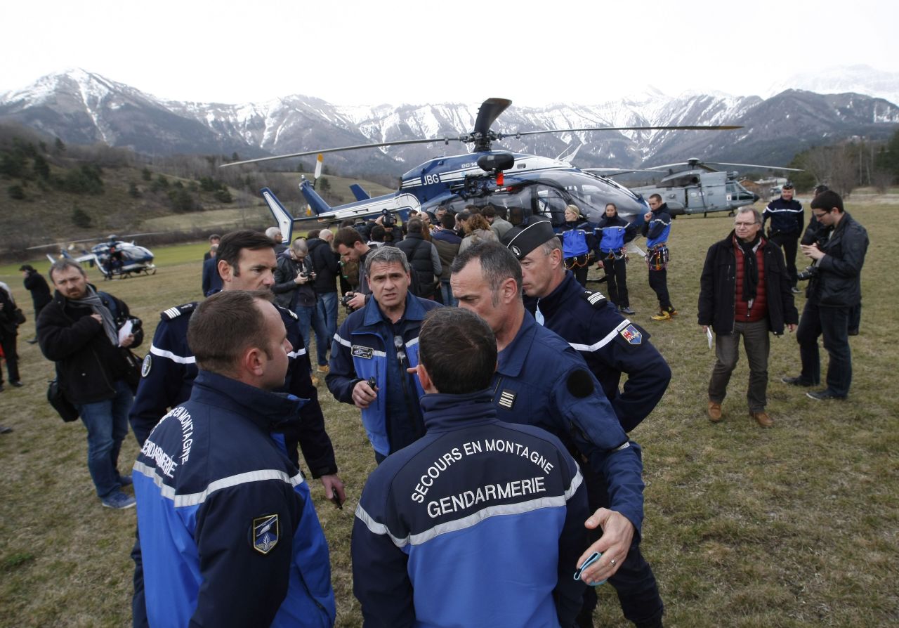 Rescue workers and members of the French Gendarmerie gather in Seyne-les-Alpes on Tuesday, March 24, as search-and-rescue teams struggle to reach the remote crash.