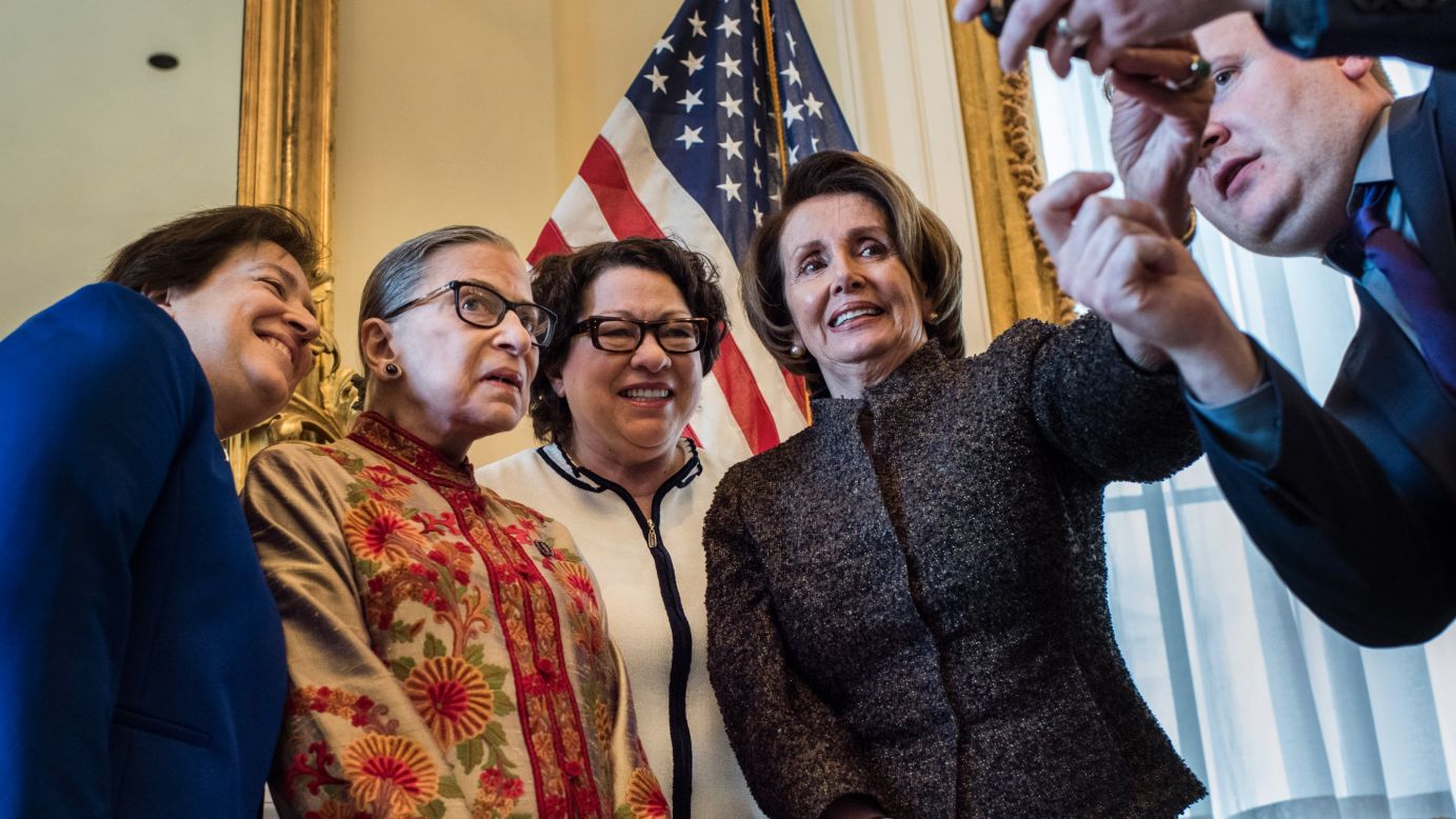 With assistance from staff member Drew Hammill, House Minority Leader Nancy Pelosi takes a selfie with the three female members of the U.S. Supreme Court on Wednesday, March 18. From left are justices Elena Kagan, Ruth Bader Ginsburg and Sonia Sotomayor.