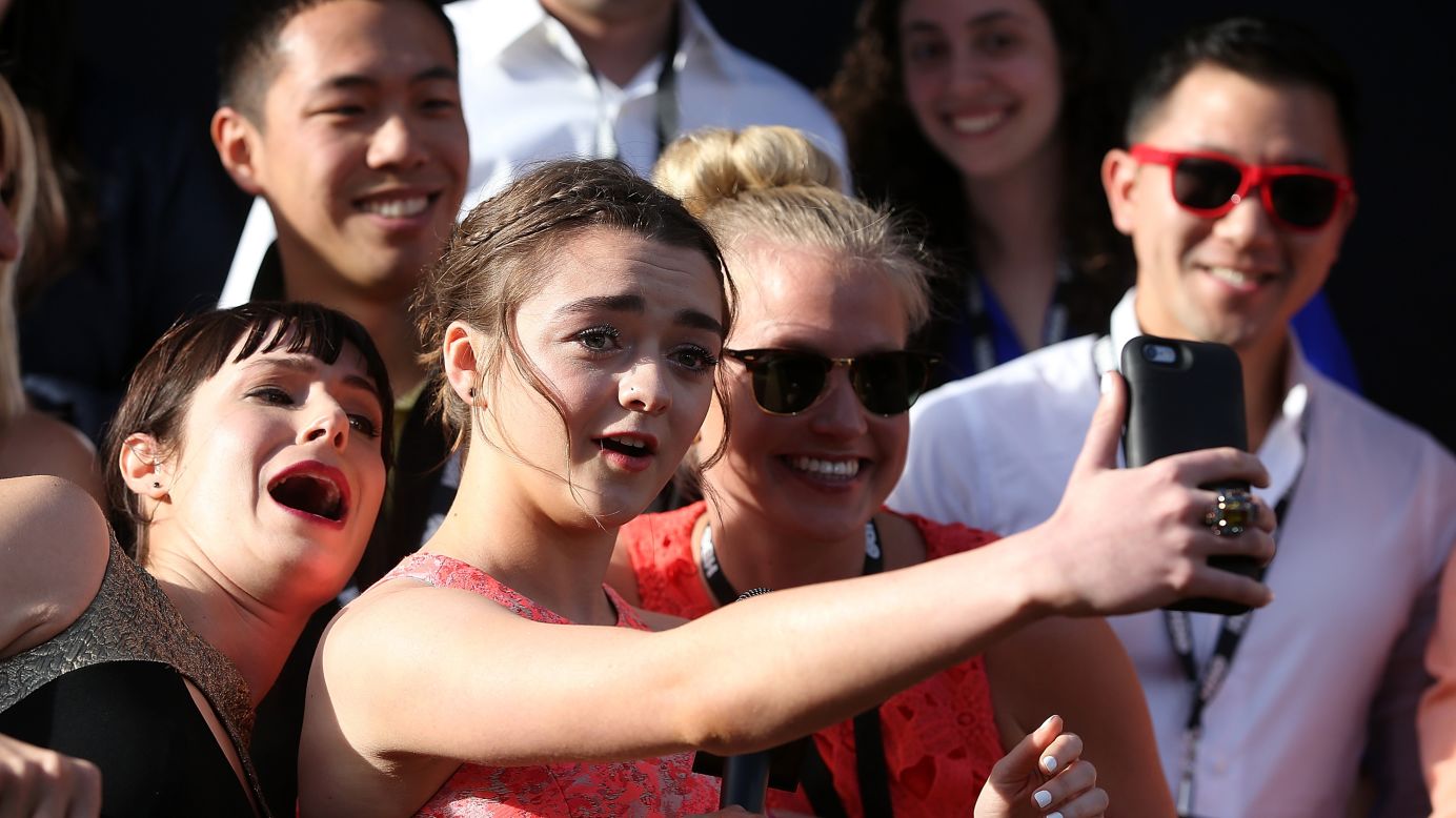 Actress Maisie Williams snaps a selfie with fans in San Francisco as she attends the "Game of Thrones" premiere on Monday, March 23.