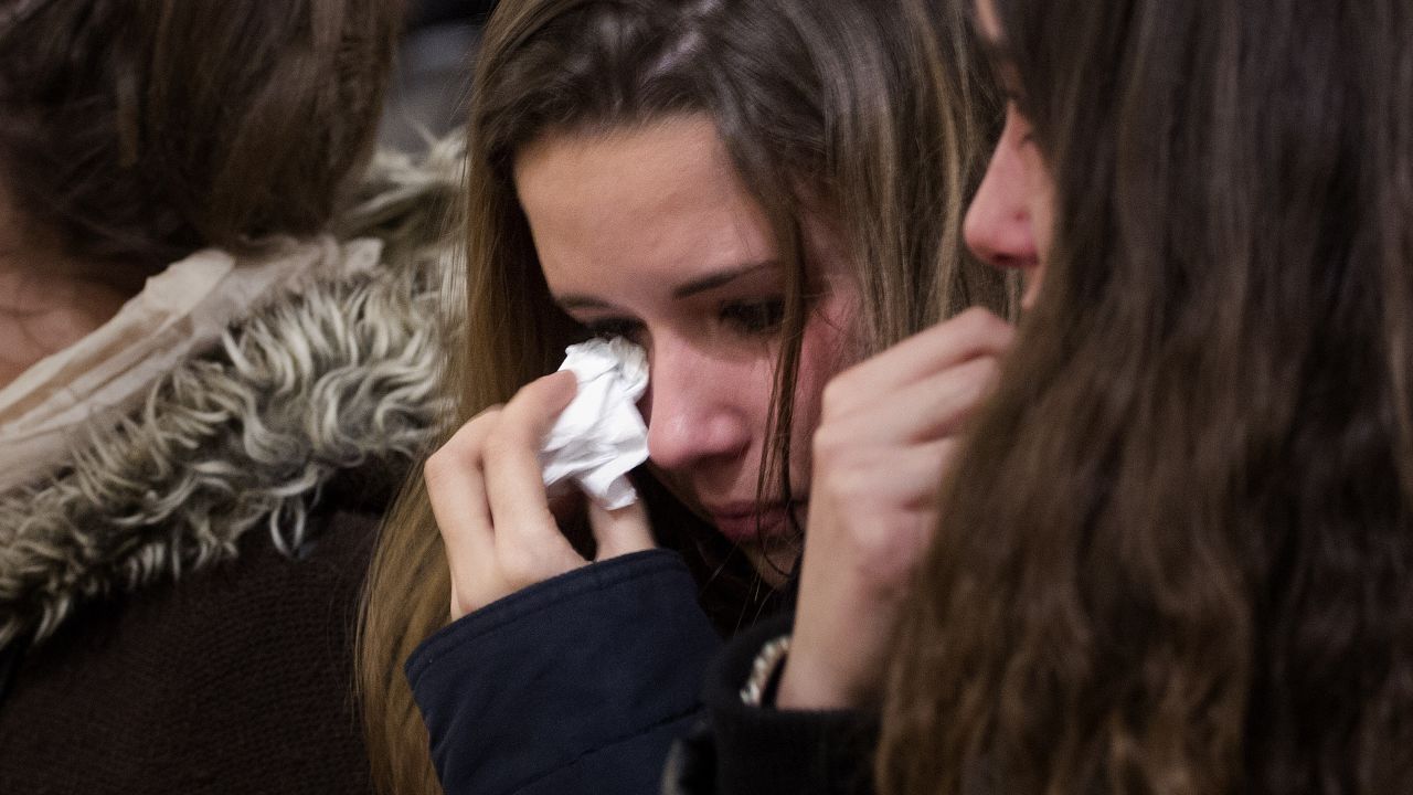 A girl wipes away tears during a mass on March 24 in Llinars del Valles, near Barcelona, Spain.