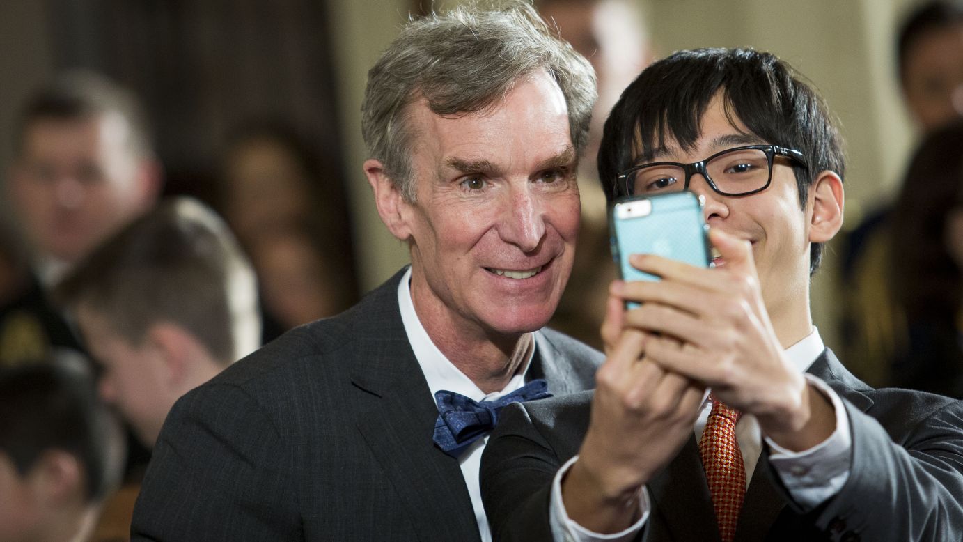 Scientist Bill Nye poses for a student at the White House Science Fair on Monday, March 23.