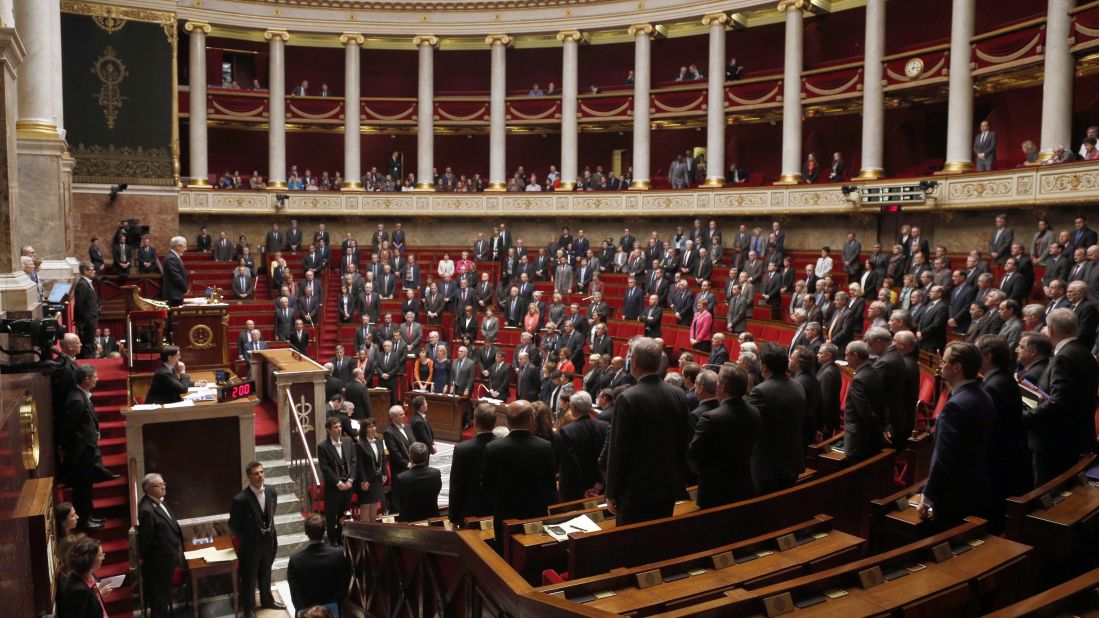 French parliament members observe a minute of silence at the National Assembly in Paris on March 24. 