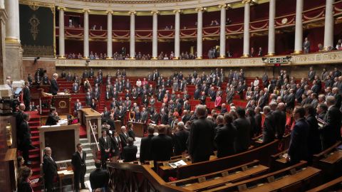 French parliament members observe a minute of silence at the National Assembly in Paris on March 24. 