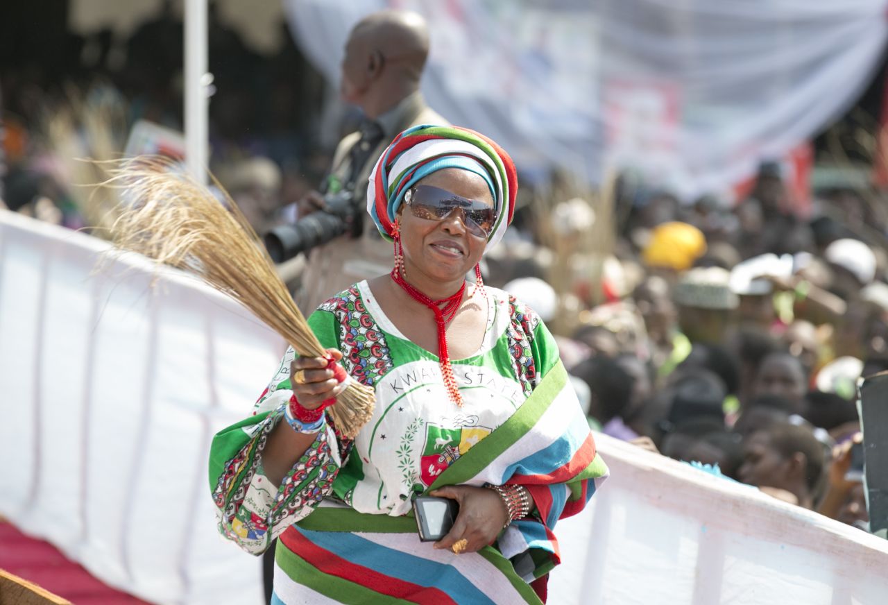 An APC supporter waves a broom, the party's symbol, at a rally in Lagos on January 30.<br />