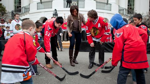 While Let's Move! has made strides in helping kids become healthy, the statistics are still daunting. Here she attends a partnership event with Chicago Blackhawks and Washington Capitals players on the South Lawn of the White House in 2011.  