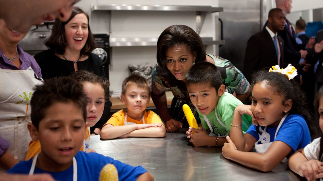 The first lady attends a chef's demonstration with third-grade students from Pocantico Hill School and John F. Kennedy Magnet School, before a luncheon at Blue Hill Farm in Pocantico Hills, New York, in 2010. 