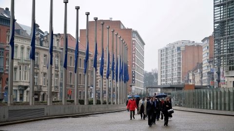 European Union flags fly at half-staff at the European Union Commission building in Brussels on March 25.