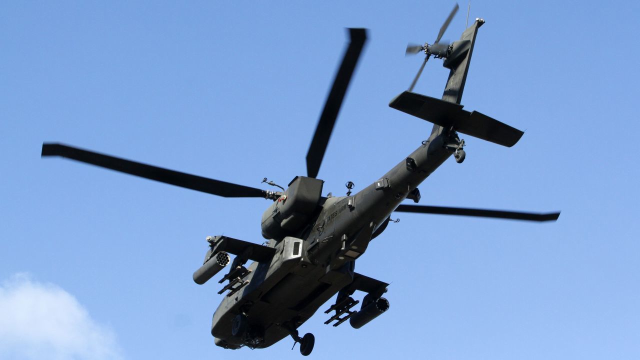 A U.S. military helicopter accompanies the convoy as it arrives in Vilnius on March 22.