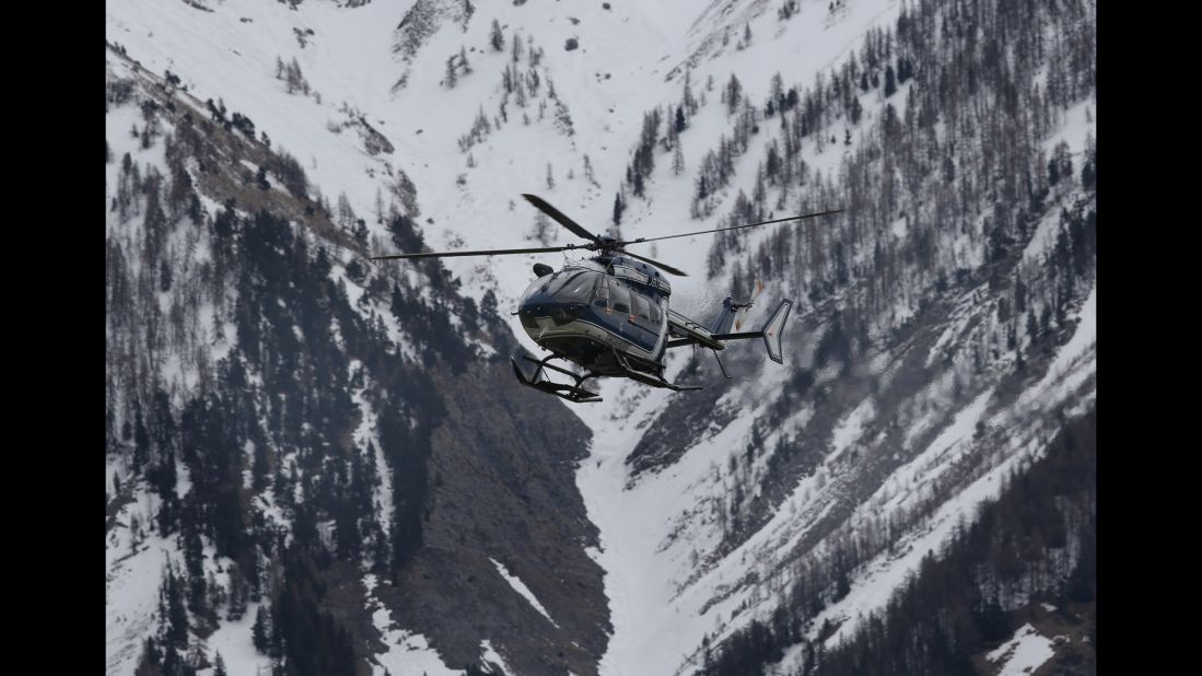 A helicopter comes in to land near Seyne-les-Alpes, the staging ground for search efforts, on March 25.