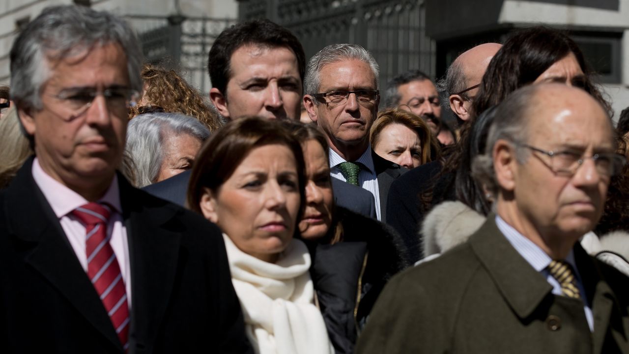 Employees and members of the Spanish Parliament hold a moment of silence in Madrid on March 25.