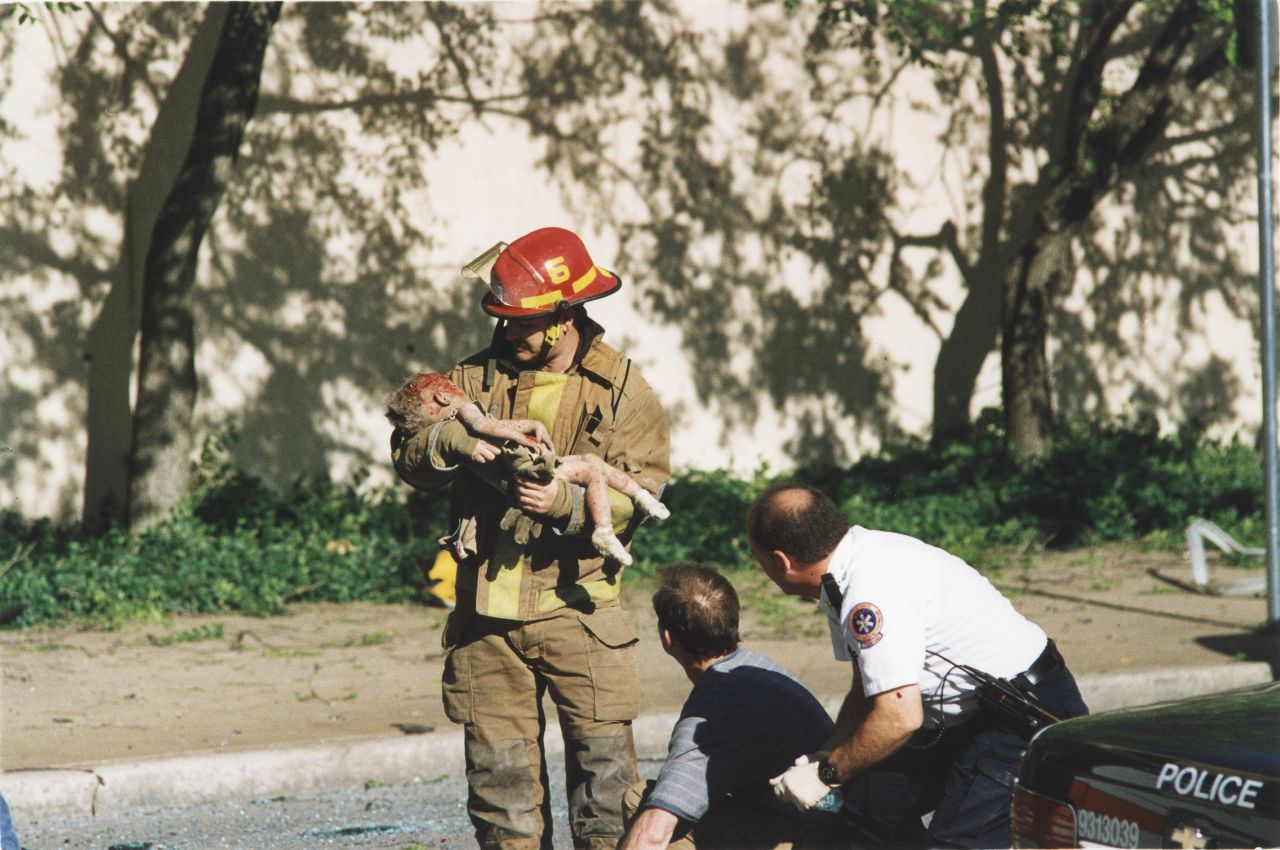 Oklahoma City firefighter Chris Fields holds a baby who was inside the Alfred P. Murrah Federal Building when it was hit by a truck bomb on April 19, 1995. The 1-year-old, Angel Baylee Almon, later died in the hospital. She was one of the 168 people killed in the terrorist attack. More than 500 people were injured.