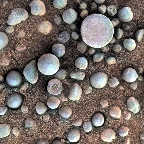 Are those Martian blueberries? These tiny spherules pepper the sandy surface in this 3-centimeter (1.2-inch) square view of the Martian surface. Opportunity took this image while the target was shadowed by the rover's instrument arm.