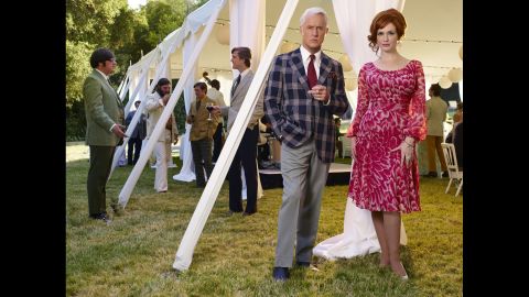 Roger Sterling (John Slattery) and Joan Harris (Christina Hendricks) dress casually -- for the times -- for an outdoor party.