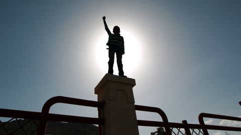 A child raises his fist during a rally by Houthi supporters in Sanaa on Friday, March 6.