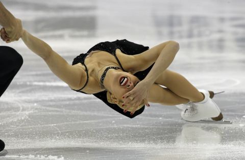 MARCH 25 - SHANGHAI, CHINA: Alexa Scimeca and Chris Knierim of the United States perform during the Pairs Short Program in the ISU World Figure Skating Championship. This year's competition is held at the Oriental Sports Center.