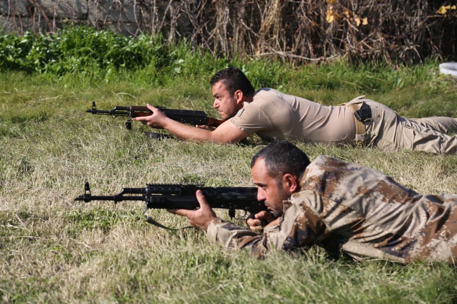 Militia recruits fire from a prone position under the instruction of SOLI trainers. 