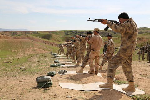 Militiamen recruits receive firing range training in Chamchamal, Iraq, from SOLI instructors.