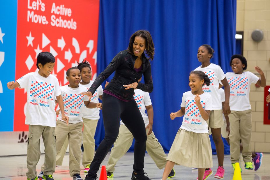 In 2010, first lady Michelle Obama started Let's Move!, an initiative to address childhood obesity and help all our kids grow up healthy. Here she participates in musical activities with students in an event at Orr Elementary School in Washington in 2013. 