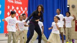 First Lady Michelle Obama participates in musical activities with students during a back to school "Let's Move!" Active Schools event at Orr Elementary School in Washington, D.C., Sept. 6, 2013. (Official White House Photo by Chuck Kennedy)