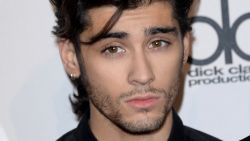 Singer Zayn Malik of One Direction, winners of Artist of the Year, Favorite Pop/Rock Band/Duo/Group and Favorite Pop/Rock Album, poses in the press room at the 2014 American Music Awards at Nokia Theatre L.A. Live on November 23, 2014 in Los Angeles, California.