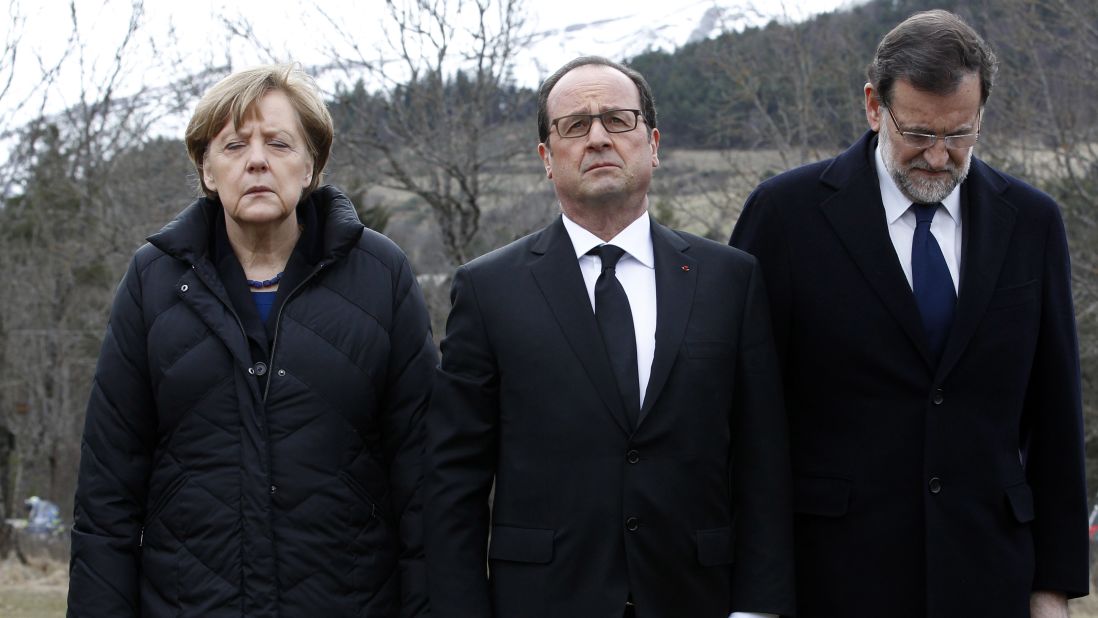 From left, German Chancellor Angela Merkel, French President Francois Hollande and Spanish Prime Minister Mariano Rajoy pay respect to victims at the crash site on March 25.