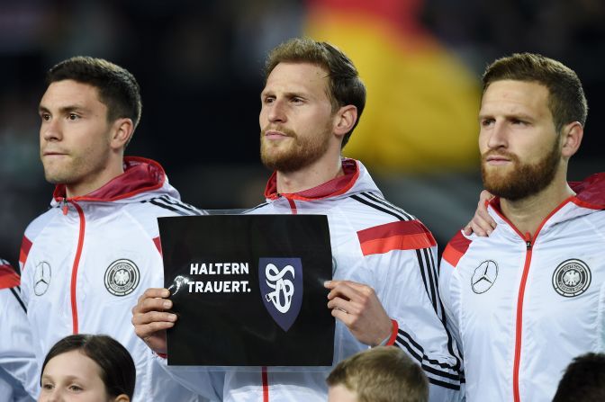 Germany's Benedikt Hoewedes holds up a sign reading "Haltern mourns." The defender was born in the town, which lost a group of teenage schoolchildren and two of their teachers -- who died <a href="index.php?page=&url=https%3A%2F%2Fwww.cnn.com%2F2015%2F03%2F25%2Feurope%2Fgermanwings-crash-main%2Findex.html" target="_blank">when the plane crashed in the French Alps en route from Barcelona to Dusseldorf. </a>