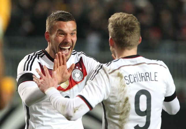 Germany, warming up for Sunday's Euro 2016 qualifier away to Georgia, earned a draw when Lukas Podolski (left) scored with nine minutes left after being set up by fellow substitute Andre Schurrle. 