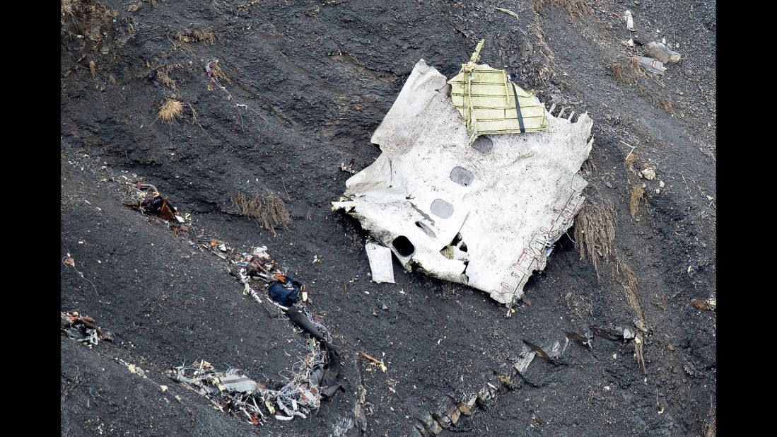 Debris from the plane is seen along a mountainside on March 25.
