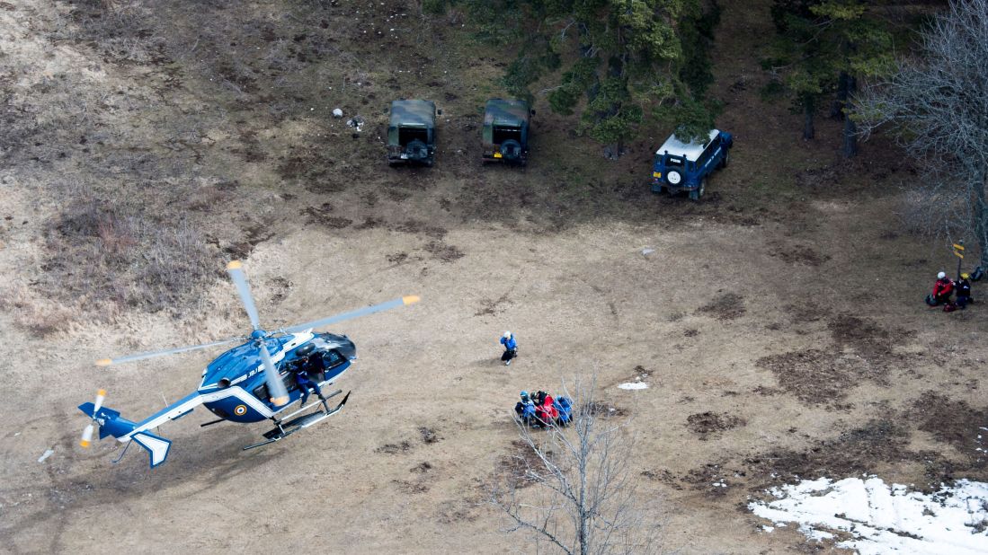 Search-and-rescue teams land near the crash site on Wednesday, March 25. 