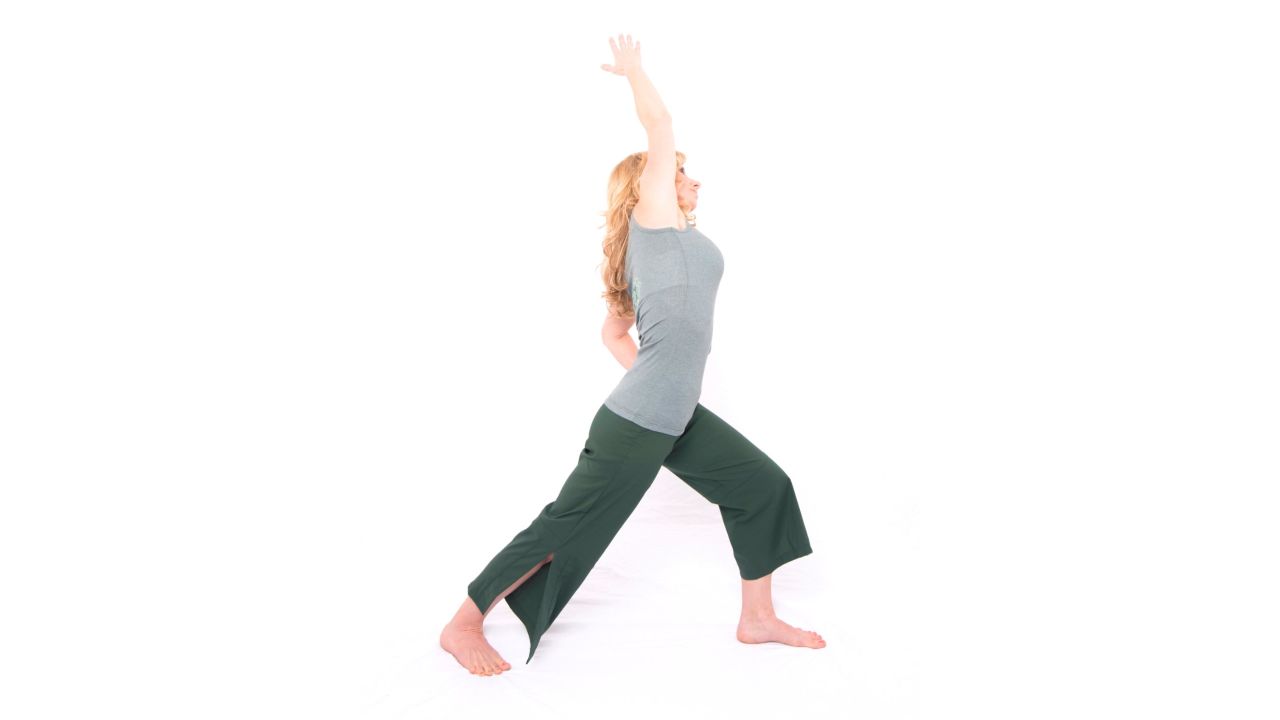 Warrior one with side bend: Lengthens calves, hip flexors and side waist muscles.<br />