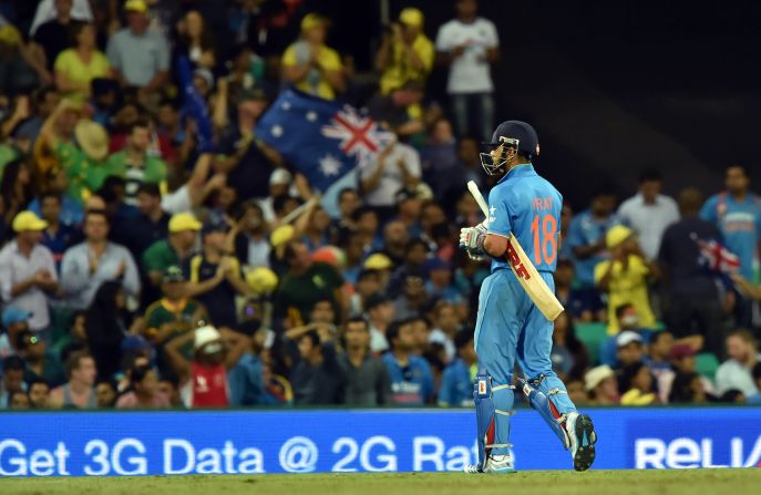 Kohli walks off after being dismissed during the 2015 Cricket World Cup semi-final match between Australia and India in Sydney on March 26, 2015. 