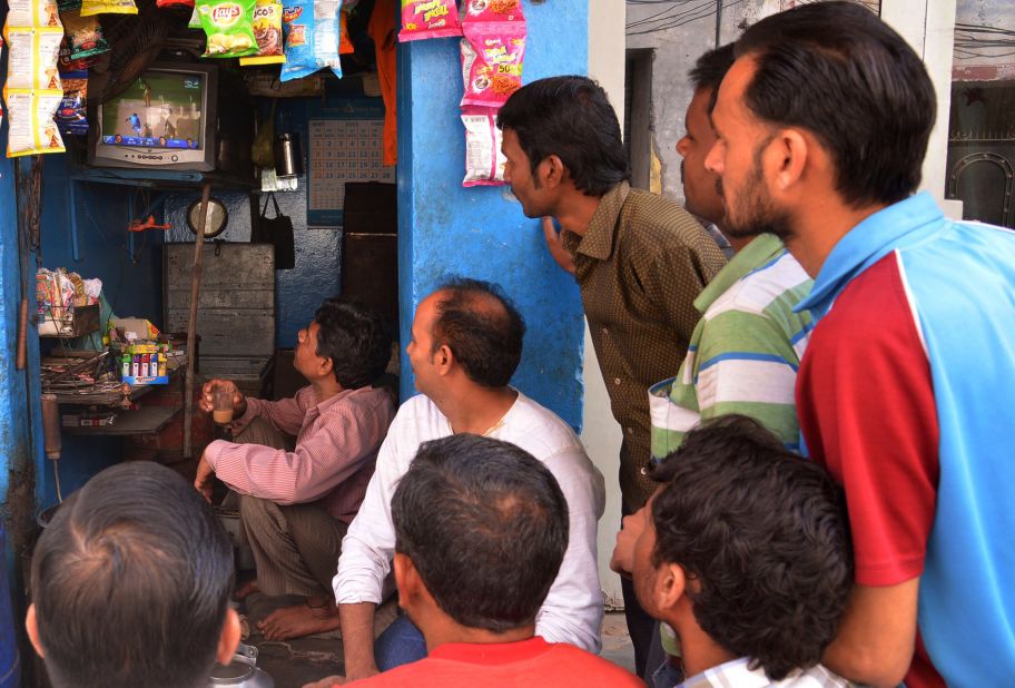 But it wasn't all happy viewing for India's legions of fans -- pictured here watching the live broadcast at a tea stall in the Indian town of Amritsar. 