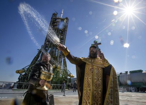 MARCH 26 - KAZAKHSTAN: An Orthodox priest conducts a blessing service in front of the Soyuz TMA-16M spacecraft at the Russian-leased Baikonur cosmodrome. The new Soyuz mission is scheduled for March 28. 