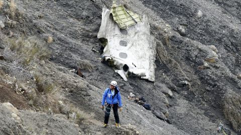 A search and rescue worker at the crash site of the Germanwings Airbus A320 that crashed in the French Alps, above the town of Seyne-les-Alpes, southeastern France, 25 March 2015. Search crews resumed helicopter flights around dawn on 25 March to the remote mountainside where Germanwings Flight 4U 9525 from Barcelona to Duesseldorf crashed after a rapid descent, likely killing all 150 people aboard on 24 March.