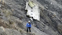 A search and rescue worker at the crash site of the Germanwings Airbus A320 that crashed in the French Alps, above the town of Seyne-les-Alpes, southeastern France, 25 March 2015. Search crews resumed helicopter flights around dawn on 25 March to the remote mountainside where Germanwings Flight 4U 9525 from Barcelona to Duesseldorf crashed after a rapid descent, likely killing all 150 people aboard on 24 March. 