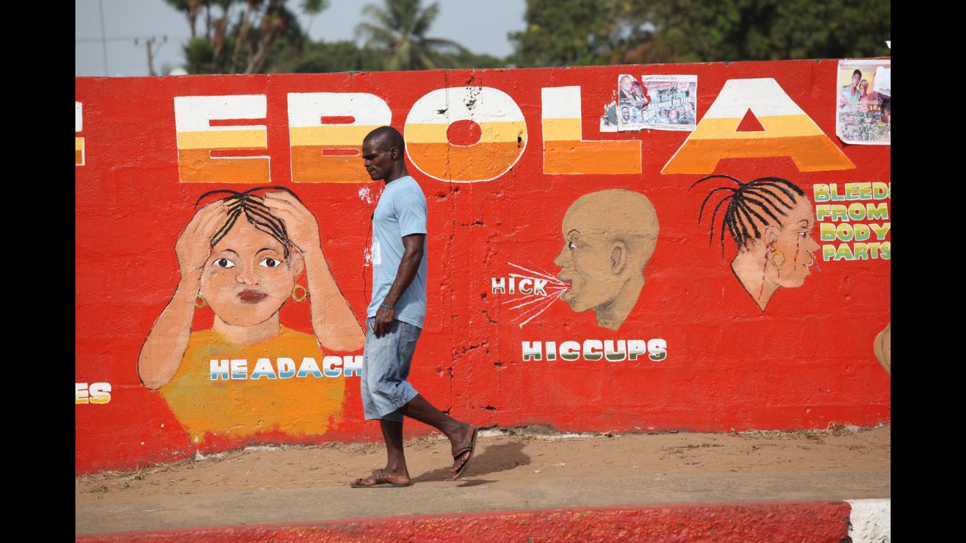 A man walks past an Ebola awareness painting in Monrovia, Liberia, on Sunday, March 22. <a href="http://www.cnn.com/2014/04/04/world/gallery/ebola-in-west-africa/index.html" target="_blank">The current Ebola outbreak in West Africa</a> has seen more than 10,000 deaths since it started just over a year ago, according to the World Health Organization.