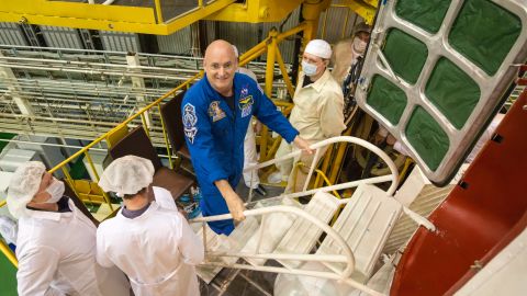 Kelly climbs the stairs to enter the spacecraft during the final check on March 23.