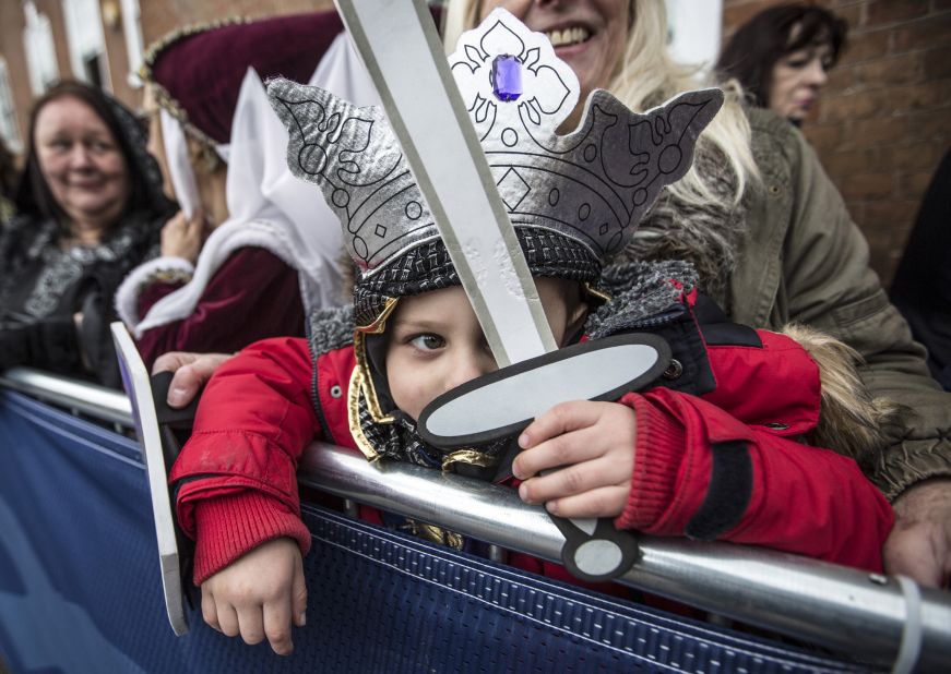 Torin Weston, 4, is dressed as Richard III as he waits with his grandmother outside Leicester Cathedral on March 26.