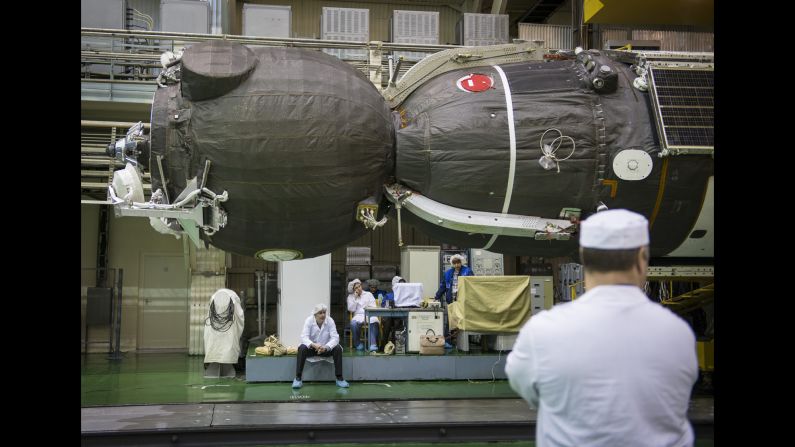The spacecraft is seen on Friday, March 20, after being lowered into position for encapsulation.
