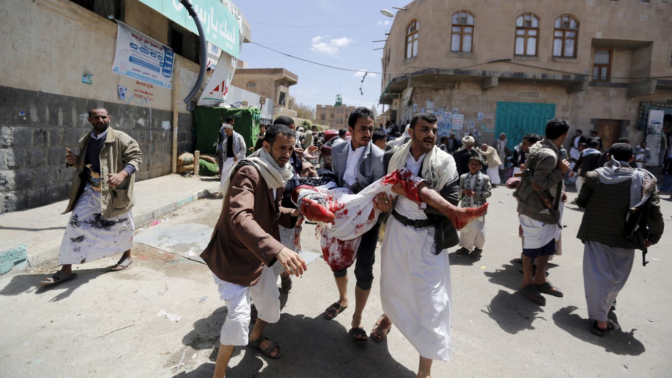 People carry an injured man out of a mosque that was attacked by a suicide bomber in Sanaa, Yemen, on Friday, March 20. <a href="http://www.cnn.com/2015/01/20/world/gallery/yemen-unrest/index.html" target="_blank">Deadly explosions in Sanaa rocked two mosques</a> serving the Zaidi sect of Shiite Islam, which is followed by the Houthi rebels that took over the capital city in January.