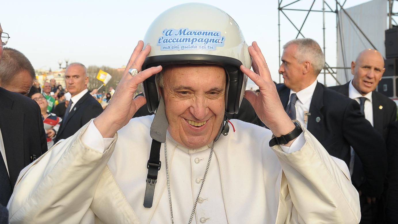 Pope Francis wears a helmet as he meets youth in Naples, Italy, on Saturday, March 21.