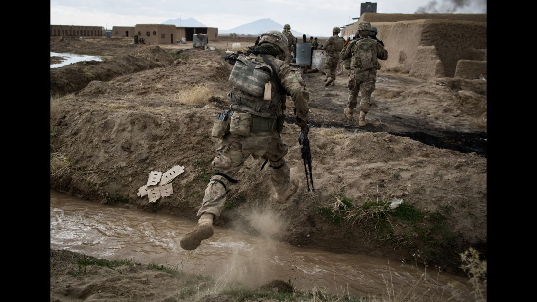 Soldiers assigned to Palehorse Troop, 4th Squadron, 2nd Calvary Regiment, traverse rough terrain in Kandahar province, Afghanistan, on February 10, 2014. The operation, a joint effort between Palehorse troops and the Afghan national army's 205th Corps Mobile Strike Force, required reconnaissance patrols in villages around Kandahar Airfield. 
