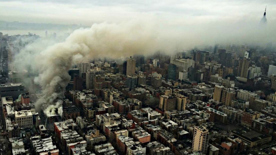 In this photo provided by the NYPD Special Ops, smoke rises from the scene of a large fire and a partial building collapse in the East Village neighborhood of New York on Thursday, March 26. The seven-alarm fire in Manhattan's East Village drew firefighters from across the city. The blast appeared to be a "gas-related explosion," Mayor Bill de Blasio said.