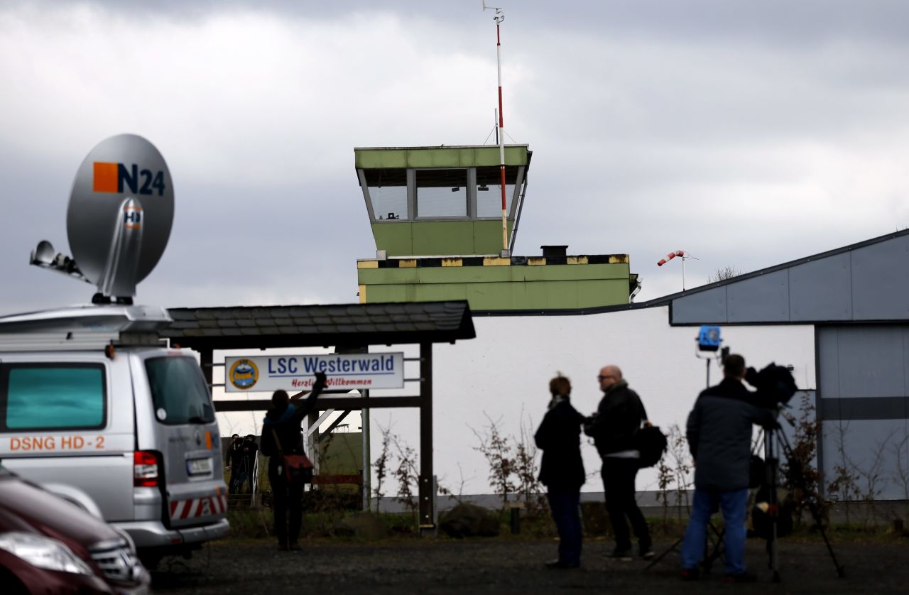 Journalists stand in front of the Westerwald airfield in Montabaur, Germany, on March 27. Lubitz reportedly learned to fly here.